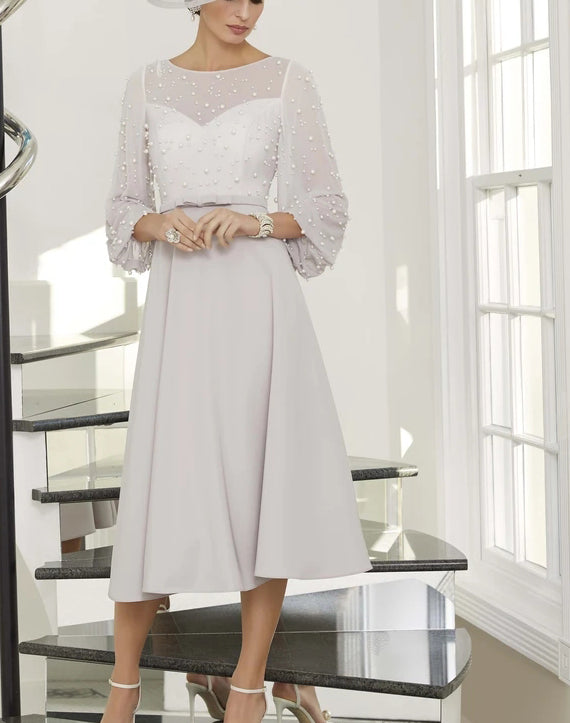 Pearl-embellished ball sleeves dress from EDKAY COLLECTION UK, elegant black clothing with stylish pearl accents and feminine design.