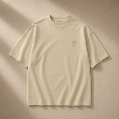 Beige oversized high-neck T-shirt from D2I Atelier by Dress 2 Impress Ltd, shown on a hanger with a relaxed fit.