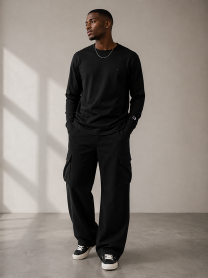 Model wearing a D2I Cotton Long Sleeve Tee by Dress 2 Impress Ltd, showing the fit and classic design in a casual setting.