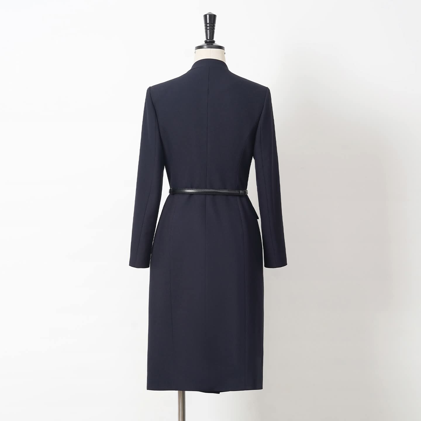 EDKAY COLLECTION UK Midnight Sovereign Wrap Dress displayed on a hanger, showcasing its elegant fabric and stylish design.
