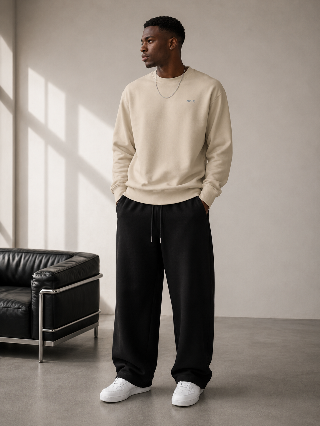 Unisex D2I Noir Essential Sweatshirt in Desert Dust color, made by Dress 2 Impress Ltd, showcasing a comfortable casual clothing style.