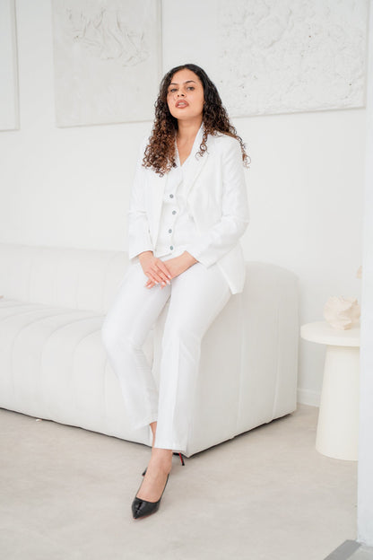 White satin 3-piece pantsuit by EDKAY COLLECTION UK featuring tailored jacket, matching pants, and a stylish top.